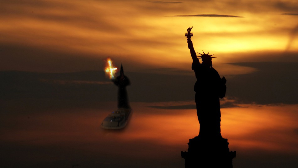 Statue of Liberty and Hooded Statue at sunset in silhouette.